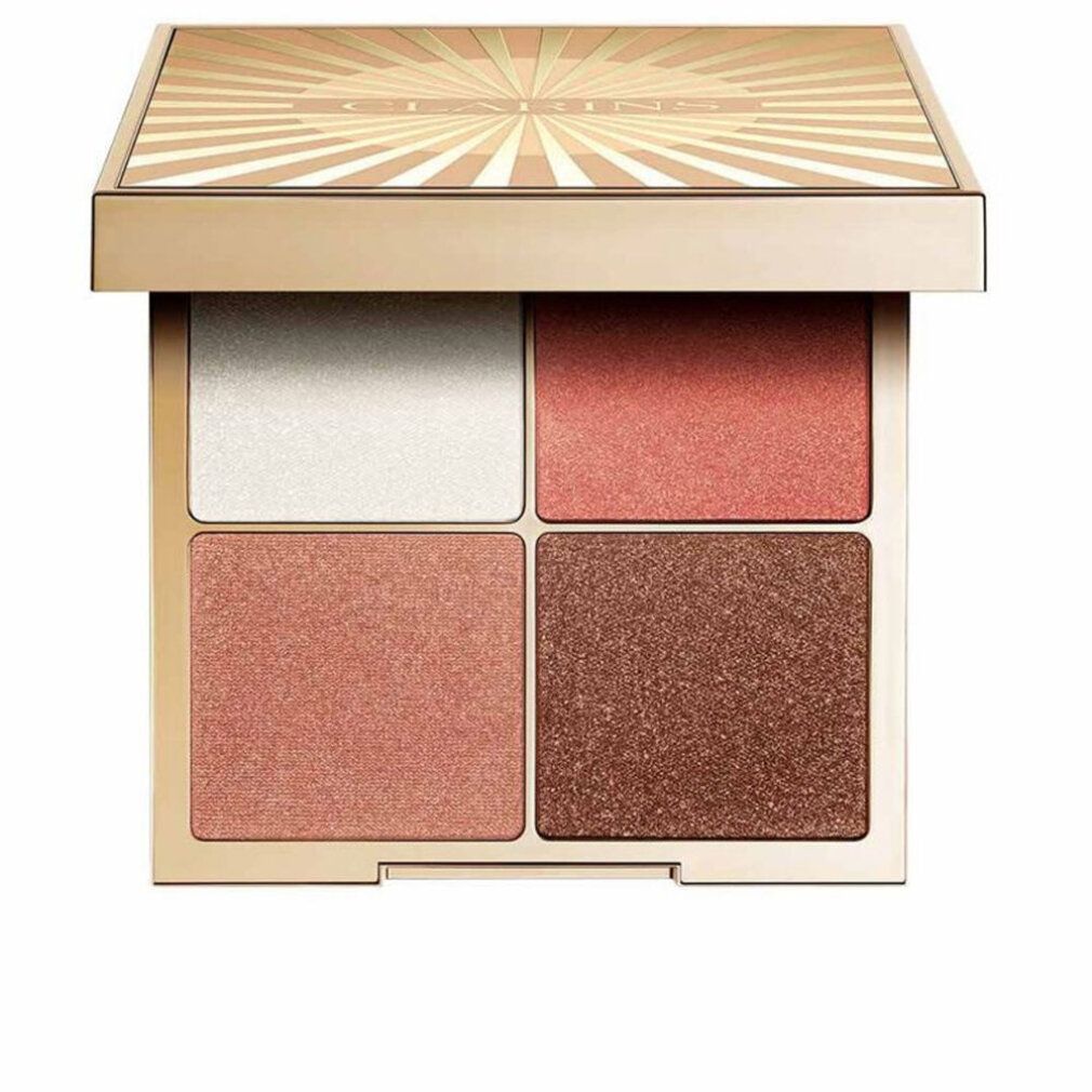 Lidschatten-Palette mit vier Farbtönen. Goldfarbene Verpackung mit Sonnenstrahlen-Design. Offen, Blick auf die Farben.