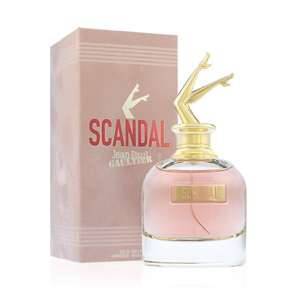 Parfümflakon mit goldfarbenem Bein-Deckel und rosa Verpackung. Aufschrift "SCANDAL" und "Jean Paul Gaultier".