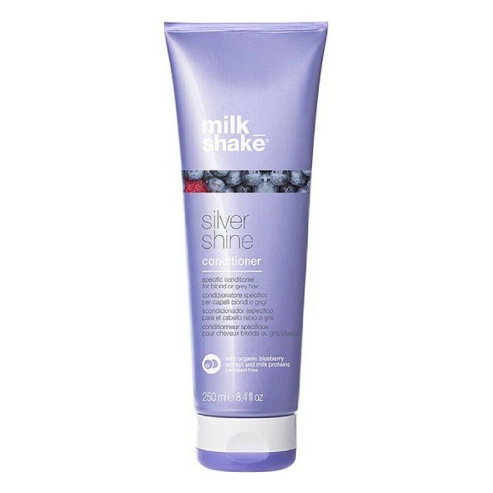 Lila Tube mit Produkt. Aufschrift: milk_shake Silver Shine Conditioner. Mit Blaubeeren-Illustration.