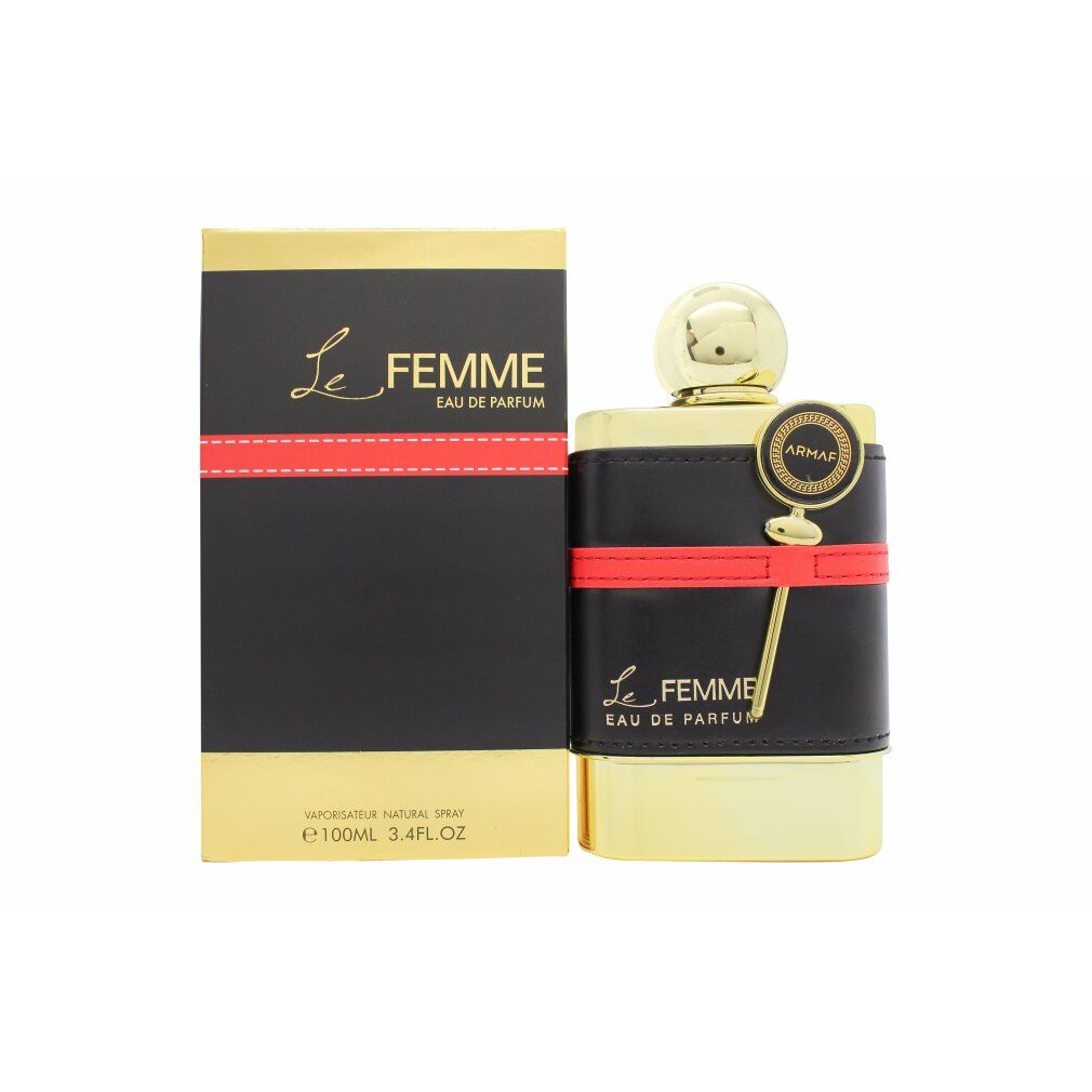 Goldfarbener Flakon mit schwarzem Lederband und rotem Streifen. Schwarze Verpackung mit goldener Schrift. Aufschrift: Le Femme.