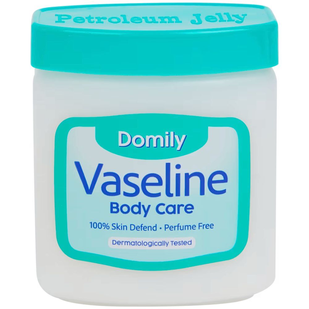 Weißer Tiegel mit blauem Deckel. Aufschrift: Domily Vaseline Body Care, 100% Skin Defend, Perfume Free, Dermatologisch getestet. Oben: Petroleum Jelly.