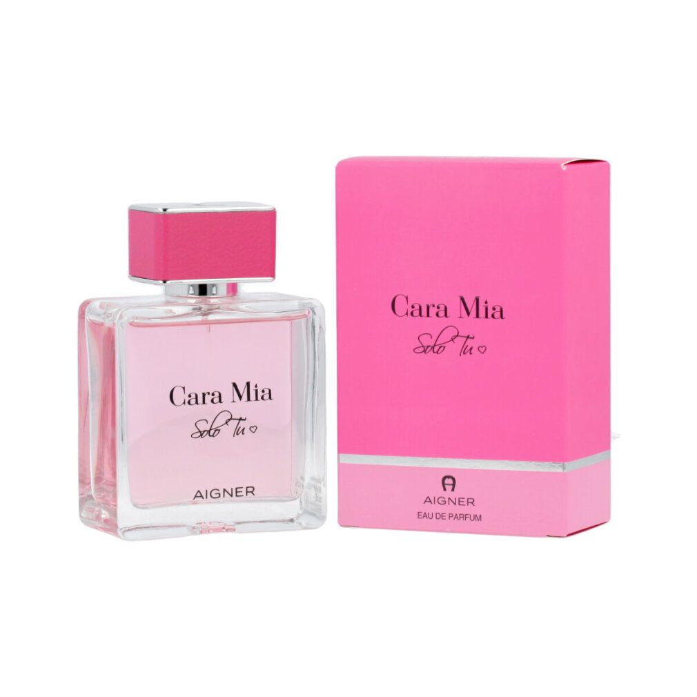 Glasflakon und rosa Verpackung. Flakon mit rosa Flüssigkeit, Schriftzug 'Cara Mia Solo Tu' und 'AIGNER'.