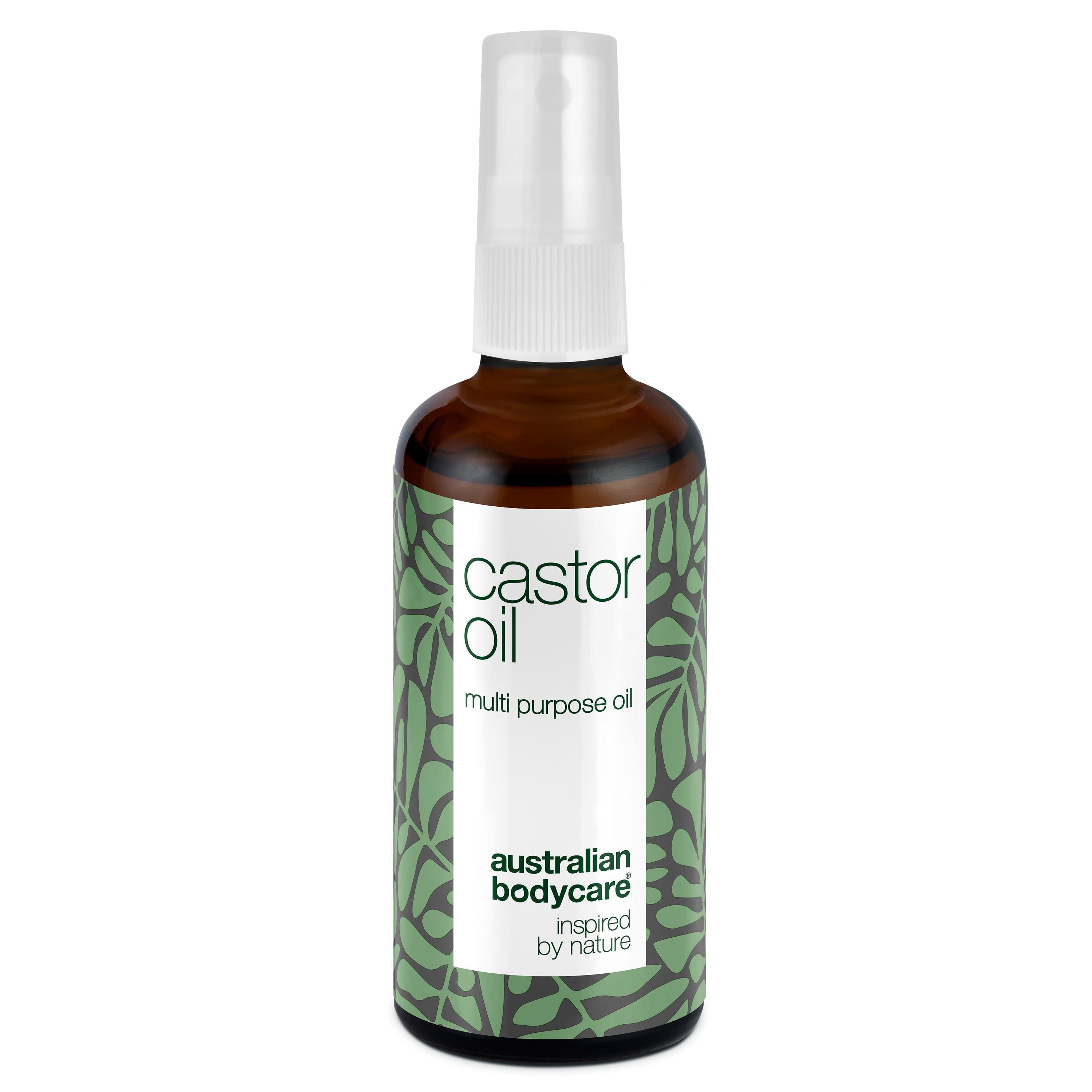 Braune Glasflasche mit Sprühkopf. Etikett mit "castor oil" und "australian bodycare".