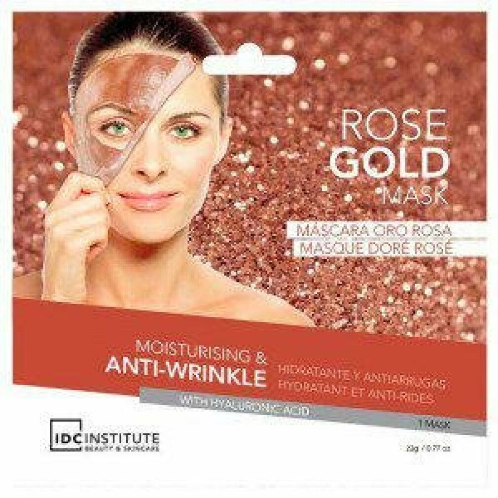 Gesichtsmaske mit Rose Gold, Anti-Falten-Effekt. Frau mit Maske auf der Hälfte des Gesichts. Verpackung mit Produktnamen und Marke.