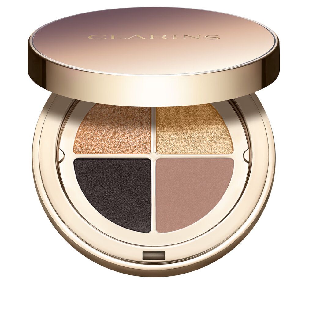 Runde Lidschattenpalette mit vier Farbtönen: Gold, Braun, Schwarz und Rosa. Deckel mit Markenlogo. Goldfarbenes Gehäuse.