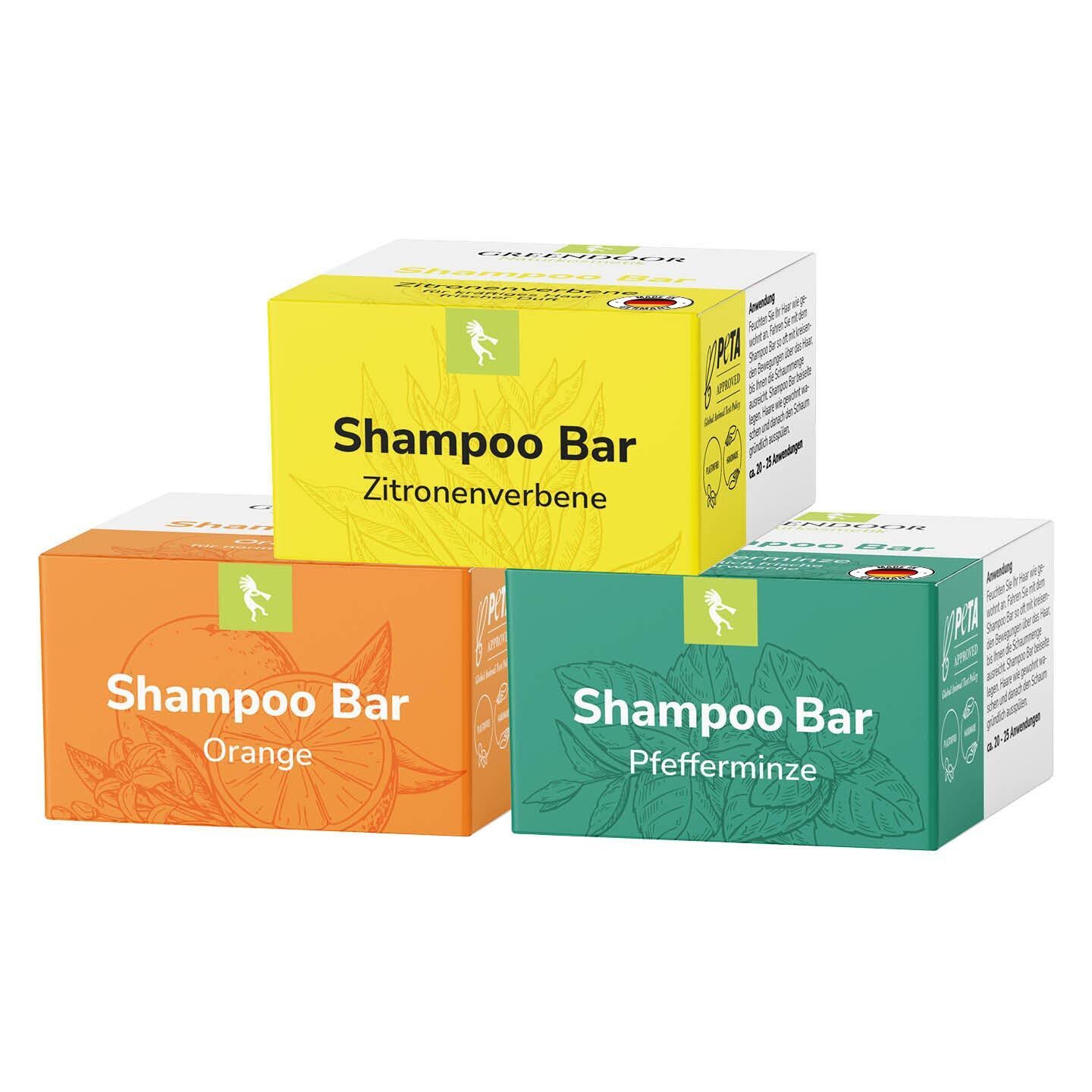 Drei GREENDOOR Shampoo Bars in den Sorten Zitrone, Orange und Pfefferminz.