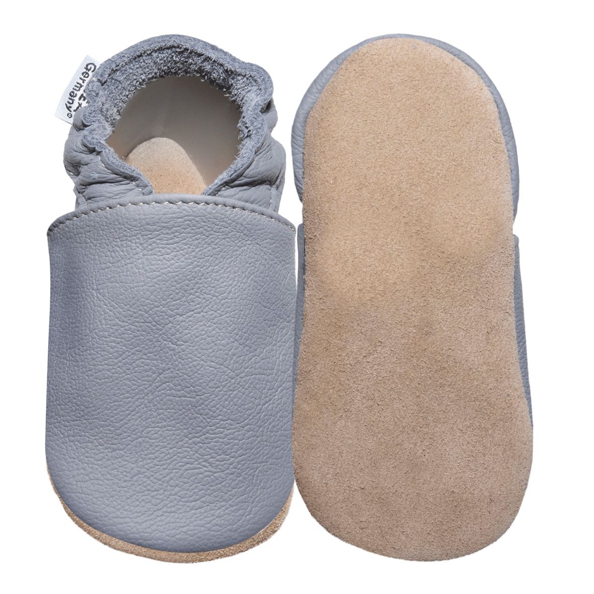 Hellgrauer Babyschuh, Leder, mit beiger Wildledersohle. Etikett "HOBEA-Germany". Ein Schuh liegt daneben.