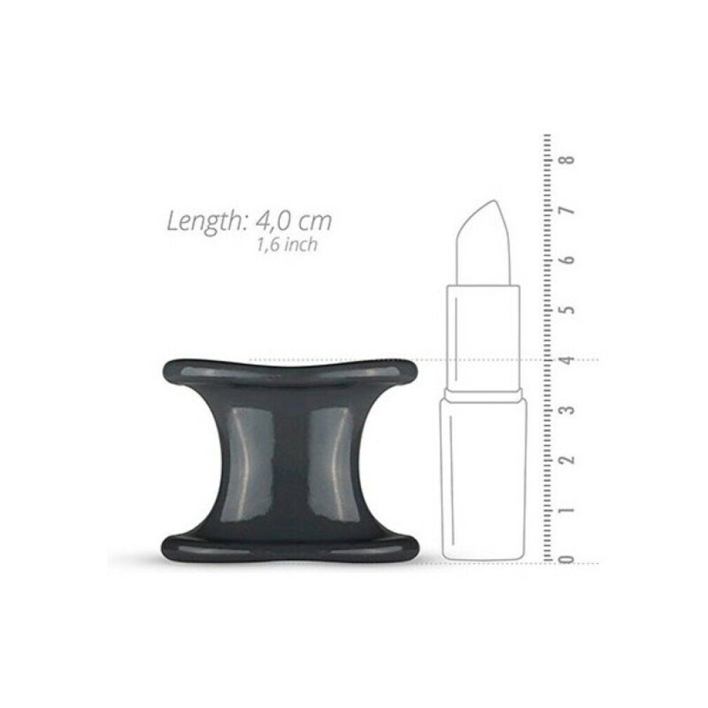 Dunkelgrauer Silikon-Ball-Stretcher neben Lippenstift. Länge: 4,0 cm, 1,6 inch. Form: Sanduhr. Material: Silikon.
