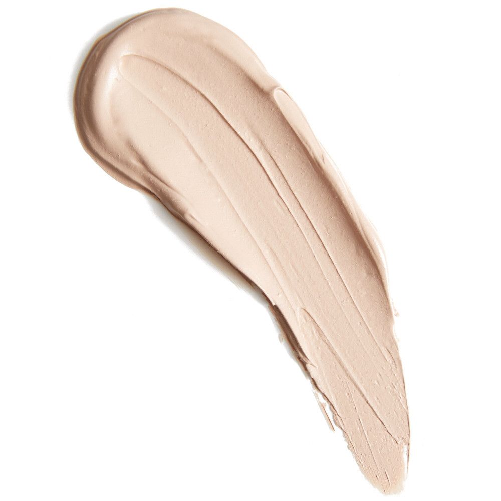 Heller Concealer-Farbton als Strich auf weißem Hintergrund. Textur sichtbar.