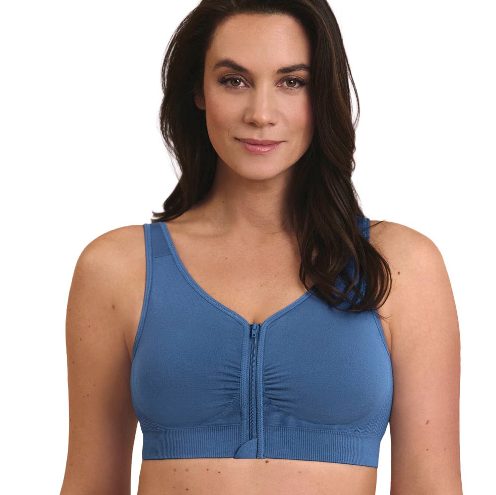 Frau in blauem Sport-BH mit Reißverschluss vorne.