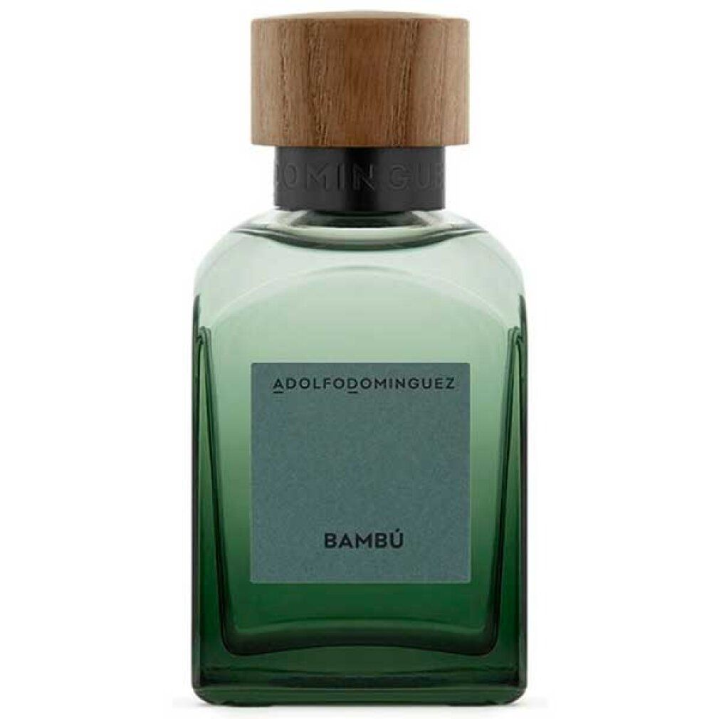 Grüne Glasflasche mit Holzdeckel. Auf dem Etikett steht "Bambú" und der Markenname "ADOLFO DOMINGUEZ".