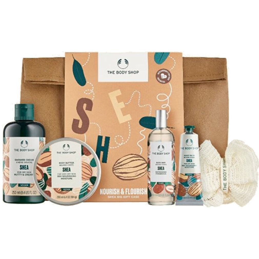 Geschenkset mit Körperpflegeprodukten. Enthält Duschgel, Körperbutter, Körperspray, Handcreme und einen Waschhandschuh. Verpackt in einer braunen Papiertüte.