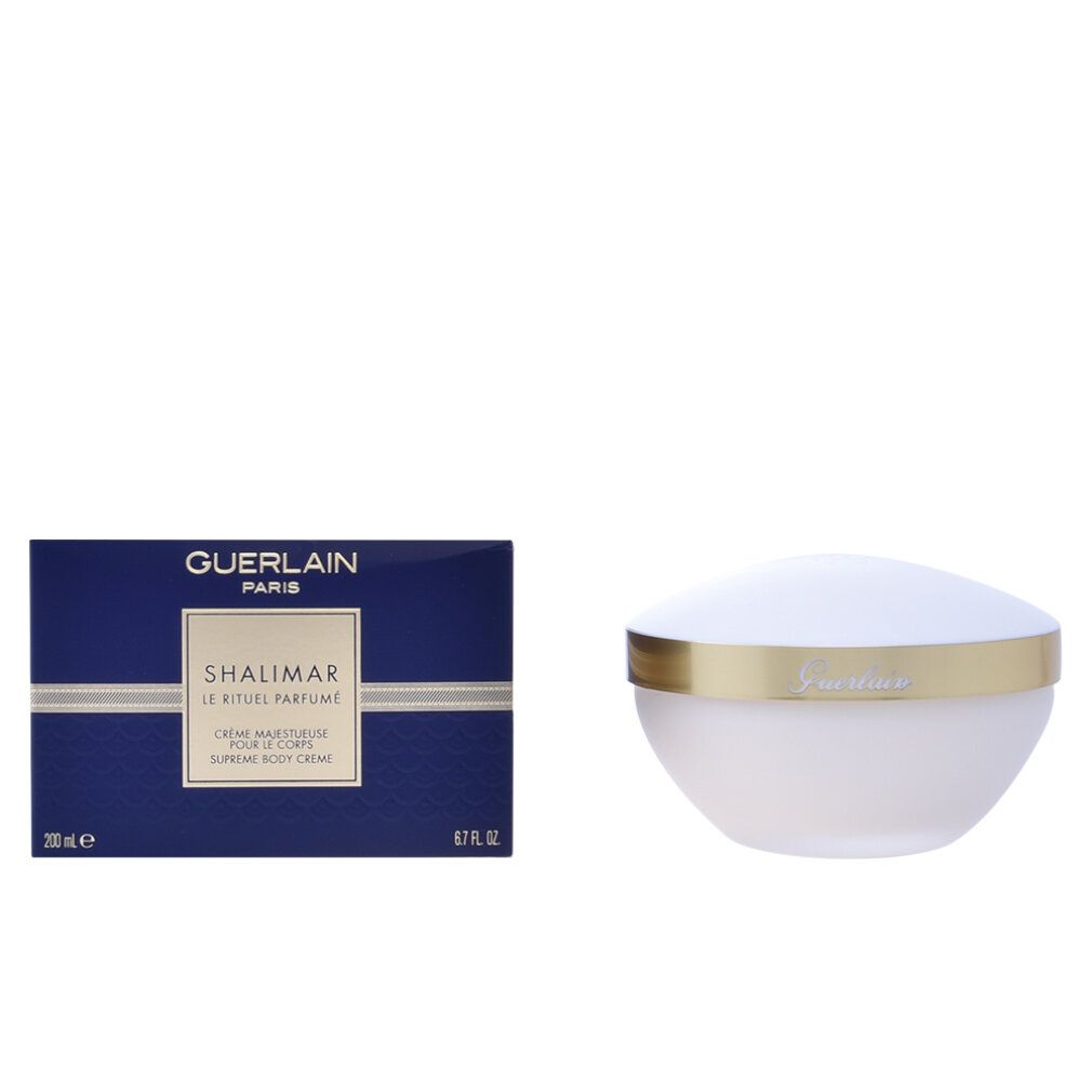 Blaue Schachtel mit Produktnamen und Logo. Weißer Tiegel mit goldenem Rand.