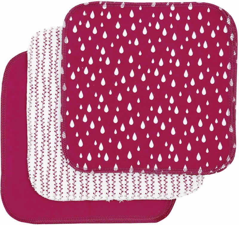 Drei quadratische Waschlappen. Einer ist einfarbig, die anderen haben Muster: Tropfen und Ranken auf weißem Grund. Alle sind rot.