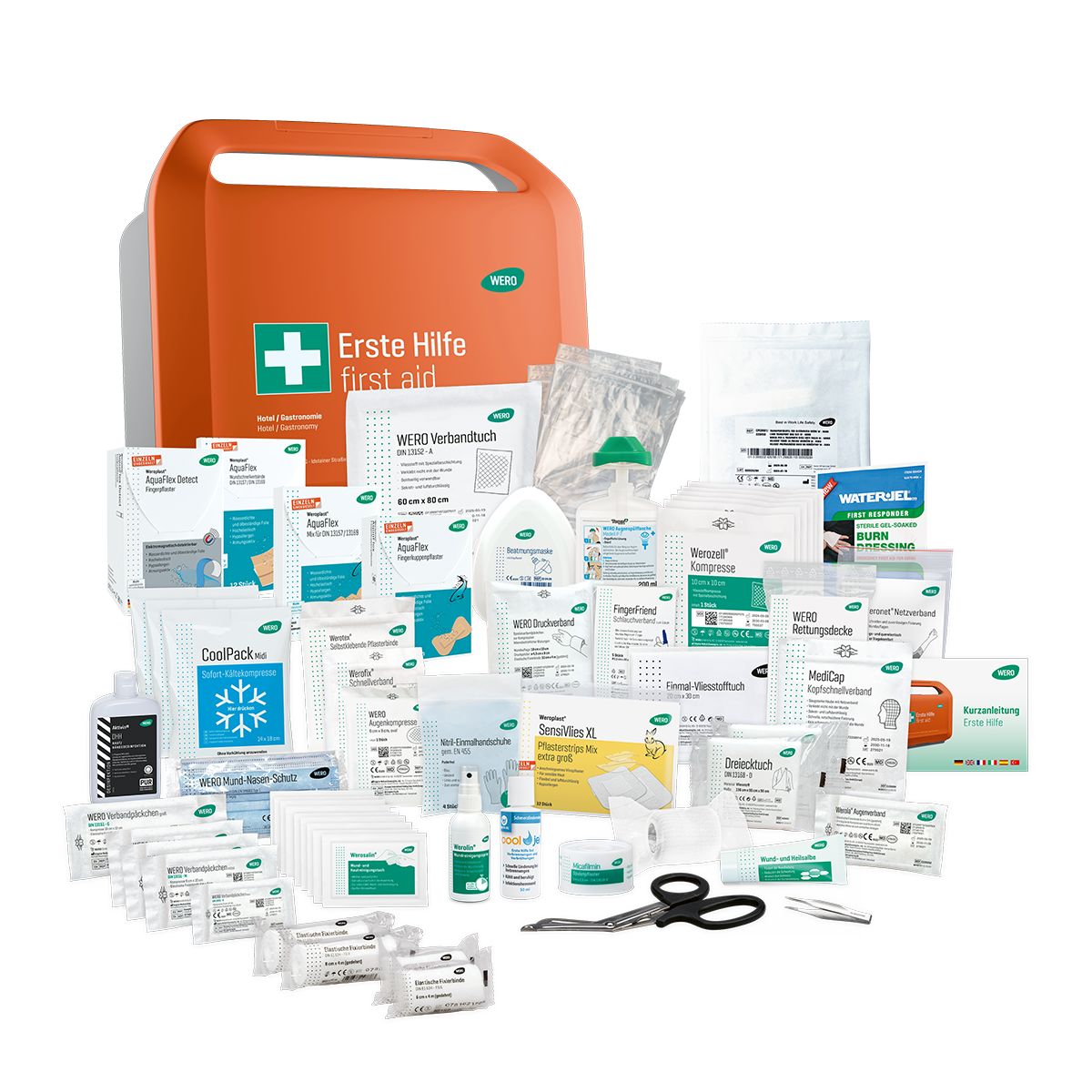 Geöffnete Erste-Hilfe-Koffer mit Inhalt. Verbandsmaterial, Flaschen, Schere, etc. Viele verschiedene Artikel.