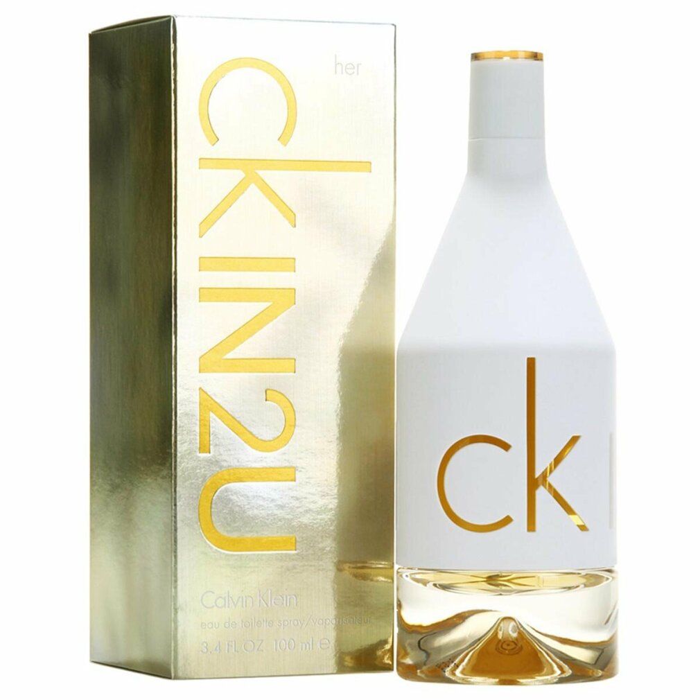 Parfümflakon und Verpackung. Flakon weiß, Schriftzug "ck". Verpackung goldfarben, Schriftzug "CK IN2U her".