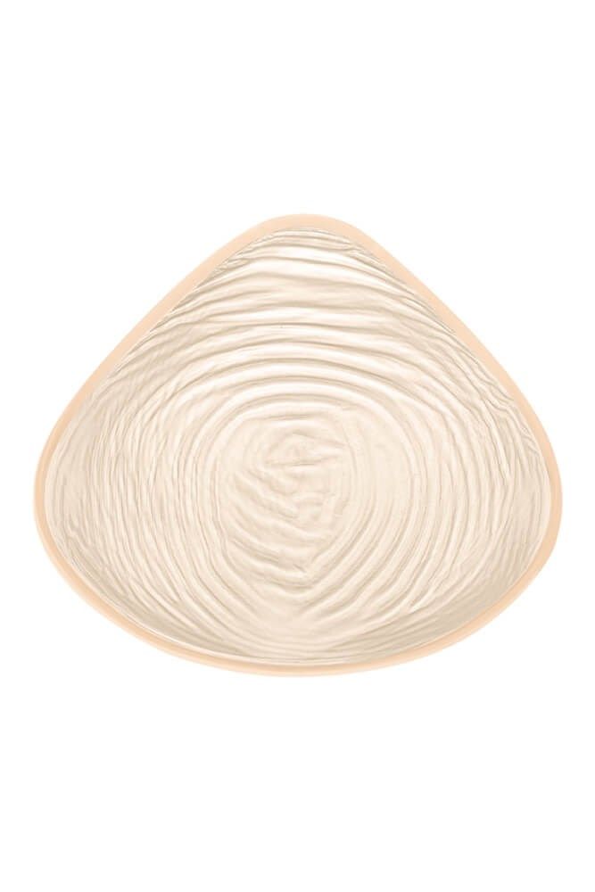 Brustprothese mit geriffelter Oberfläche. Tropfenförmig. Beige.