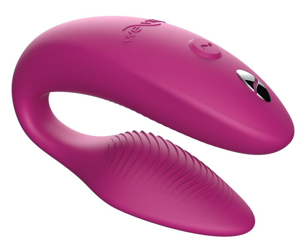 Rosa Wellness-Produkt mit geschwungener Form und geriffelter Oberfläche. Mit Logo und Bedienknopf.