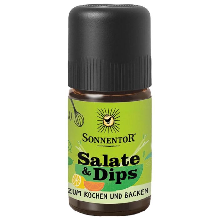 Braune Glasflasche mit schwarzem Deckel. Aufschrift: Sonnentor, Salate & Dips, Zum Kochen und Backen. Grünes Etikett mit Illustrationen.
