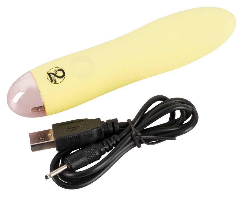 Gelber Mini-Vibrator mit rosa Spitze und USB-Ladekabel.