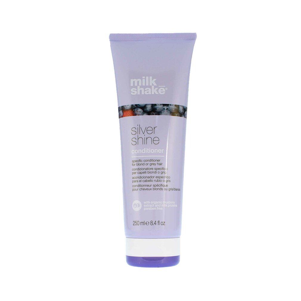 Lila Tube mit Produkt. Aufschrift: milk_shake Silver Shine Conditioner. Mit Blaubeeren-Illustration.