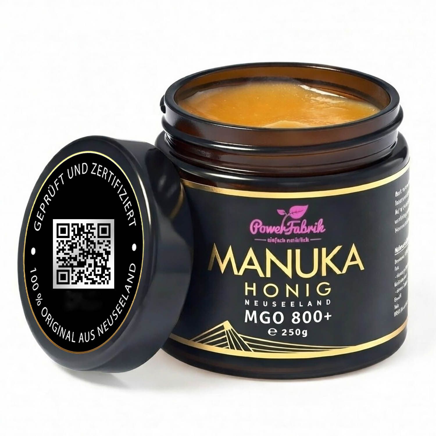 Glas mit Manuka Honig, Deckel daneben. Aufschrift: PowerFabrik Manuka Honig, MGO 800+. Zertifizierungslogo.