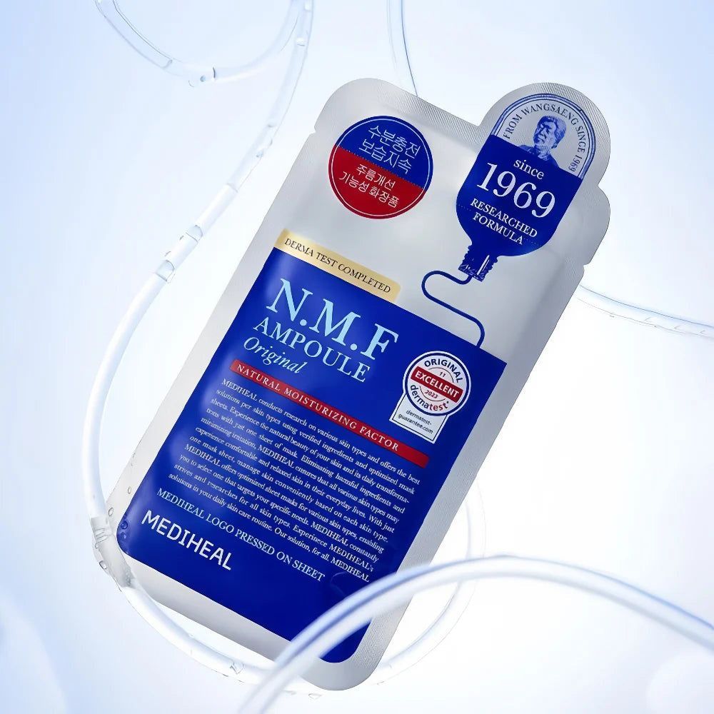 MEDIHEAL N.M.F Ampoule Original Tuchmaske. Weiße Verpackung mit blauer Beschriftung. Produktname und Logo deutlich sichtbar.