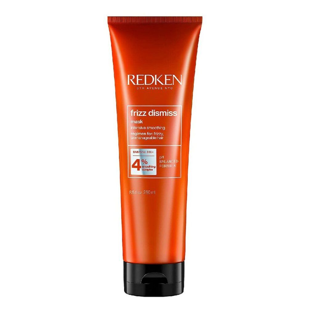 Orangefarbene Tube mit Produktnamen und Text. Schwarzer Deckel. Marke Redken, Produkt Frizz Dismiss Mask.
