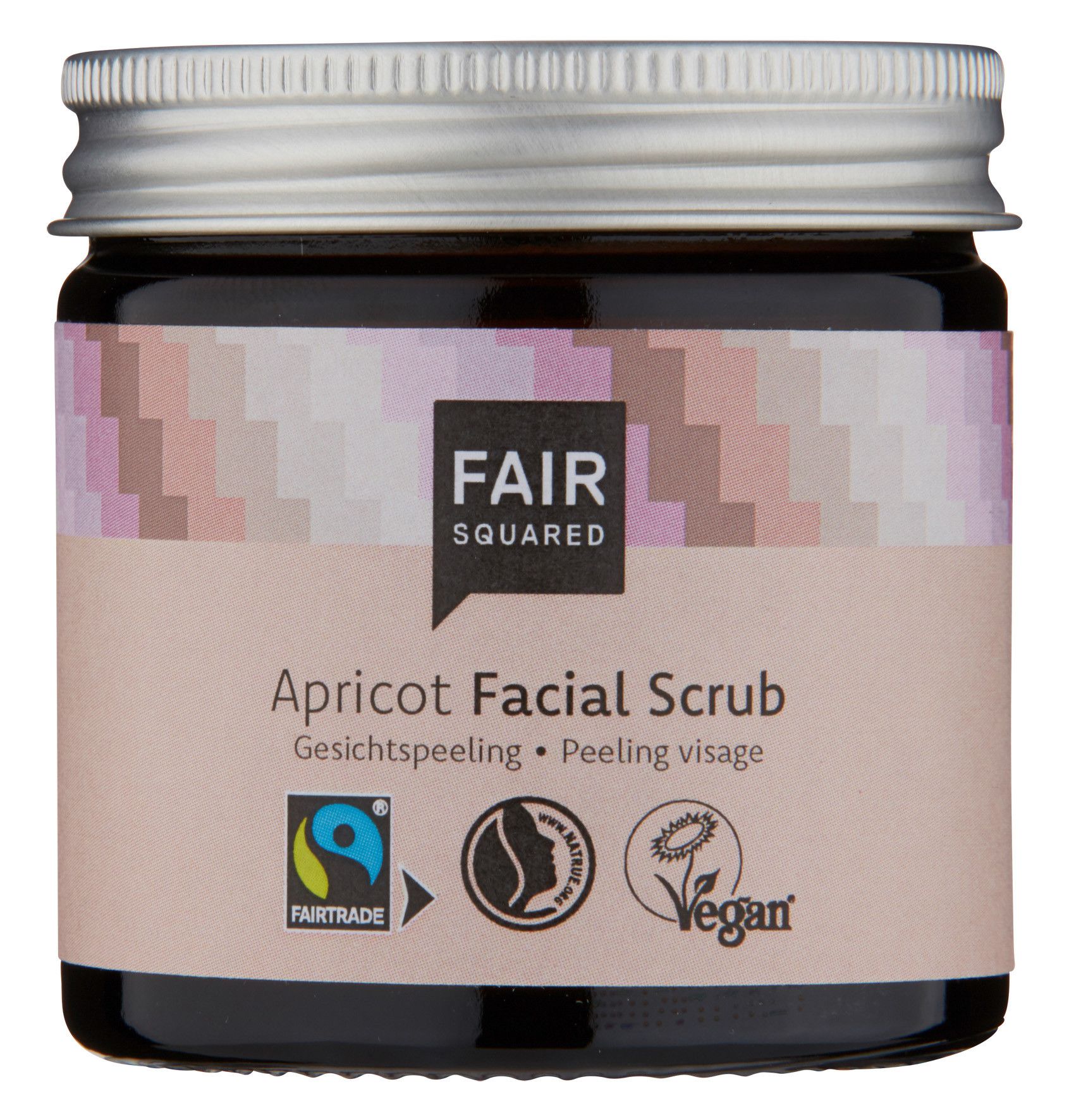 Braunes Glas mit silbernem Deckel. Aufkleber mit FAIR SQUARED Logo und Aufschrift Apricot Facial Scrub. Fairtrade-Siegel und Vegan-Logo.