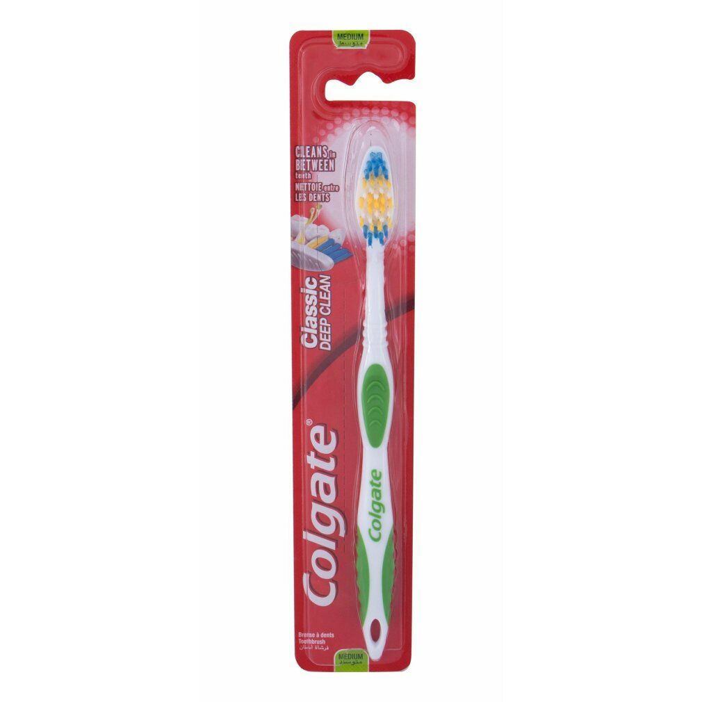 Colgate Classic Zahnbürste in Verpackung. Grüner Griff, weiße Borsten mit gelben und blauen Akzenten. "Classic Deep Clean" Text.