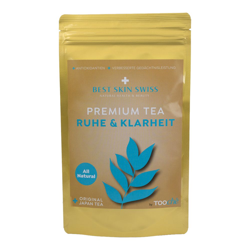 Goldfarbene Verpackung mit Aufschrift "Premium Tea Ruhe & Klarheit". Blaue Blätter-Illustration. Text: "Best Skin Swiss".