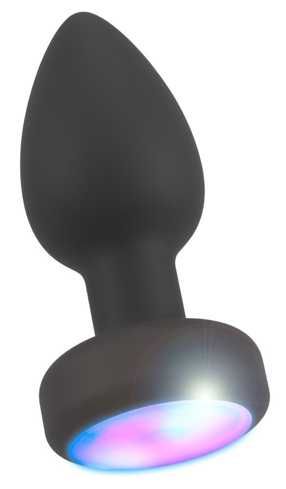 Schwarzer Analplug mit LED-Lichteffekt. Kegelförmiger Schaft mit rundem, farbig beleuchtetem Ende. Lichteffekt.