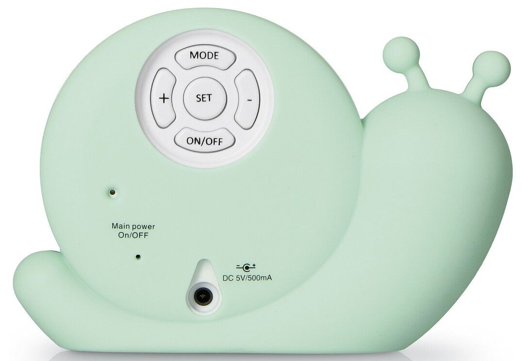 Rückseite eines grünen Schlaftrainers in Schneckenform. Knöpfe für Modus, Set, Ein/Aus. Anschlüsse.