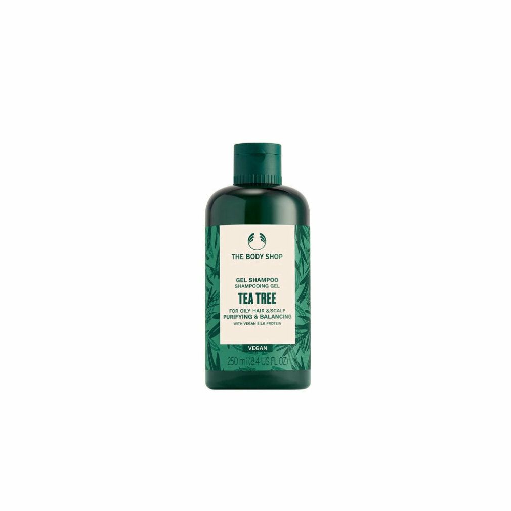 Grüne Flasche Gel Shampoo. Etikett mit Produktnamen und Inhaltsstoffen. Vegan.