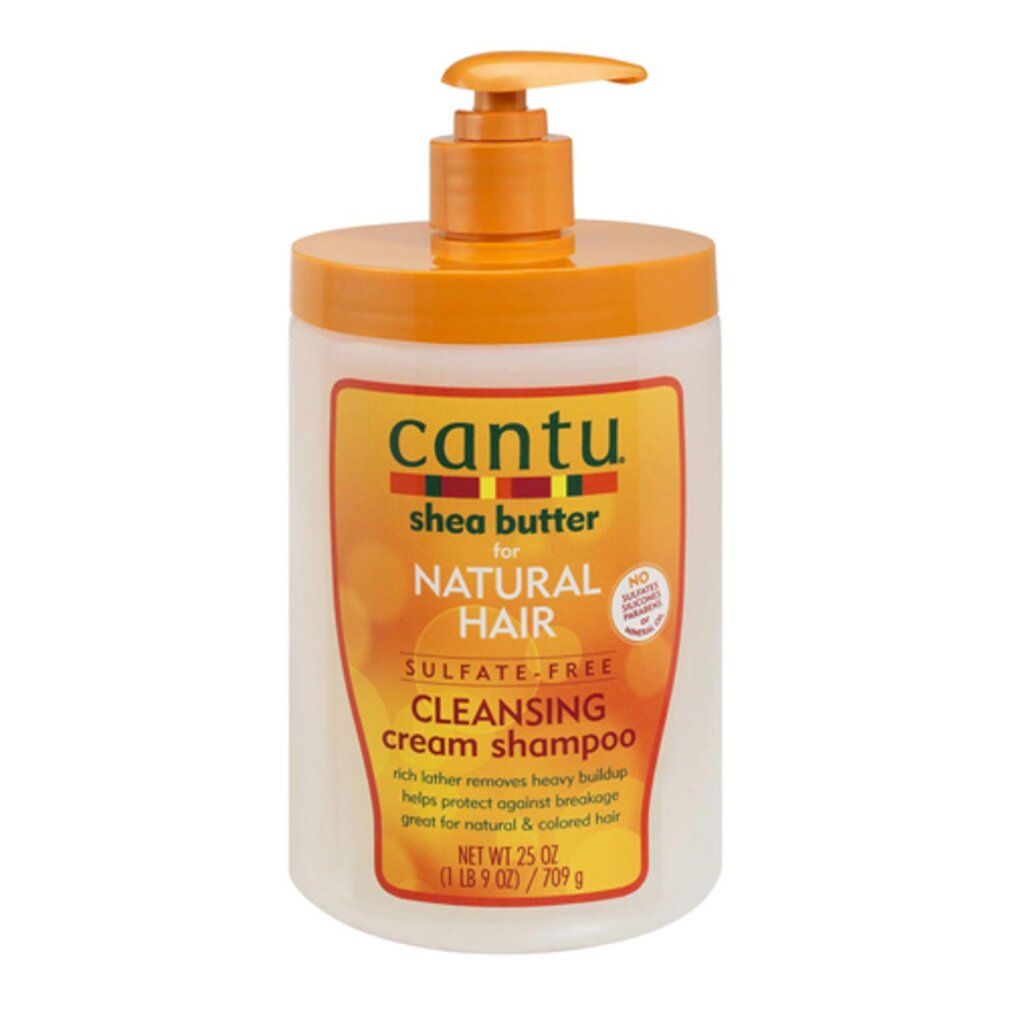 Shampoo-Flasche mit Pumpverschluss. Aufschrift: Cantu, Shea Butter, für Natural Hair, Cleansing Cream Shampoo. Orange und Weiß.