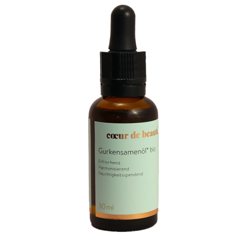 Braune Glasflasche mit schwarzem Deckel und Pipette. Aufschrift: Coeur de Beauté Gurkensamenöl bio. 30 ml.