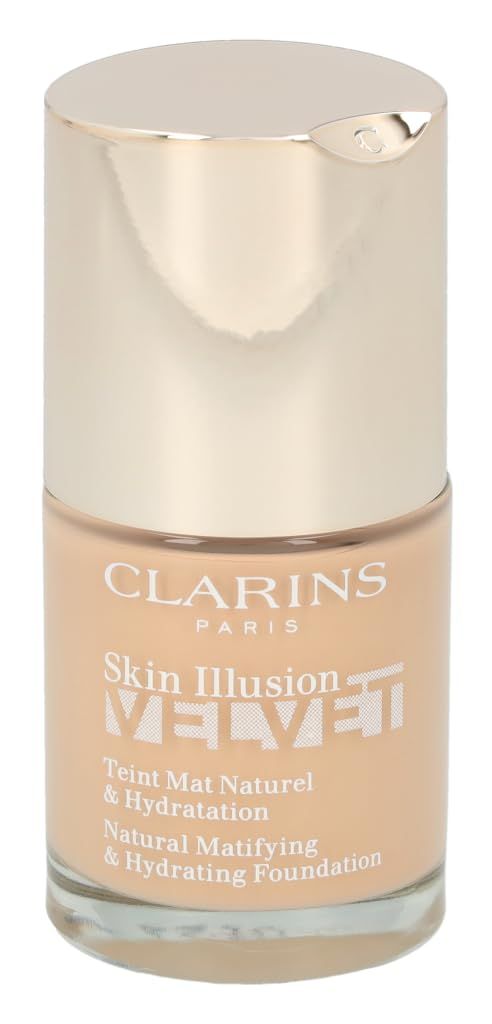 Beige Foundation-Flakon mit goldenem Deckel. Aufschrift: Clarins, Skin Illusion Velvet, Teint Mat Naturel & Hydratation.