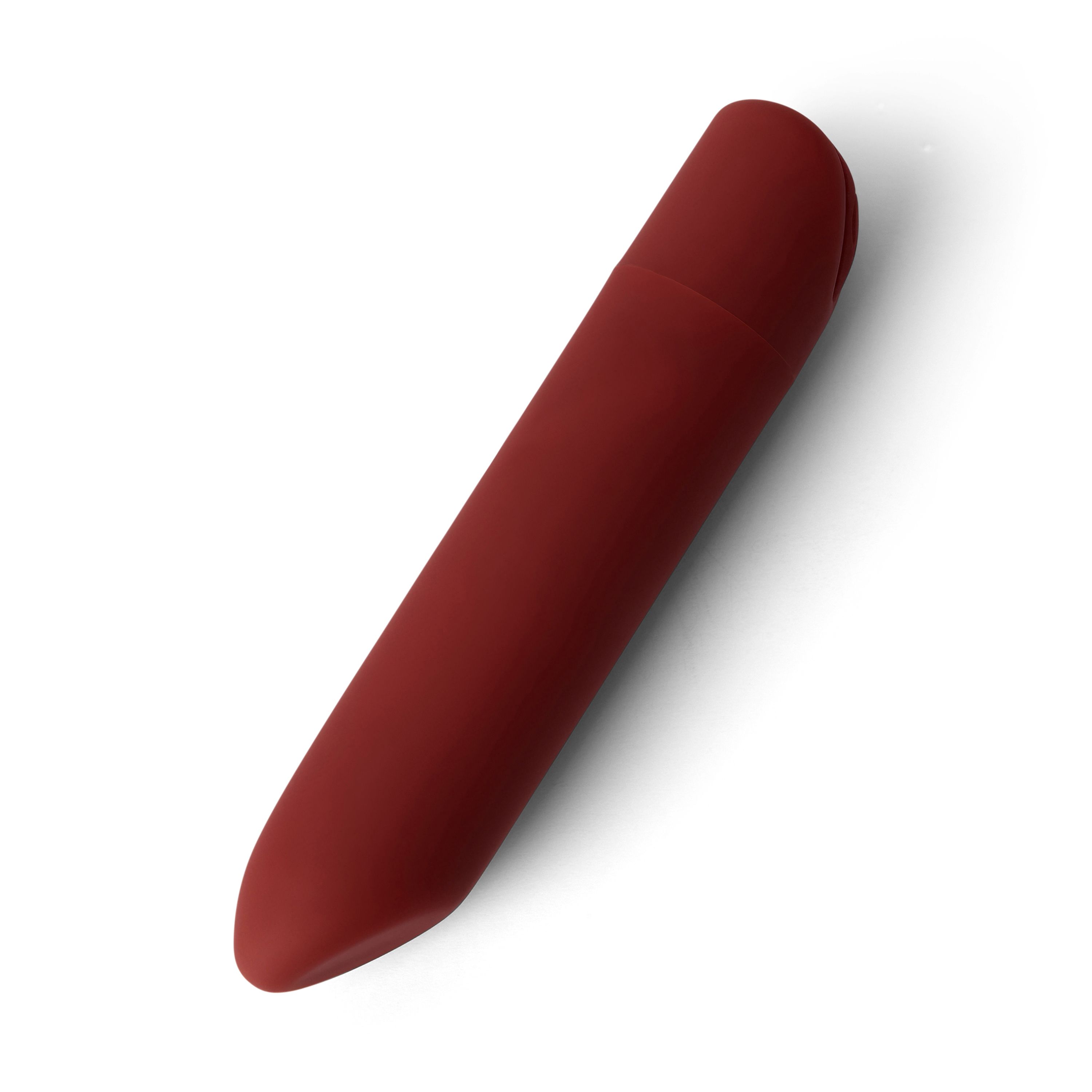 Roter, länglicher Gegenstand mit abgerundeten Enden. Oberseite mit einer leichten Vertiefung. Auf weißem Hintergrund.