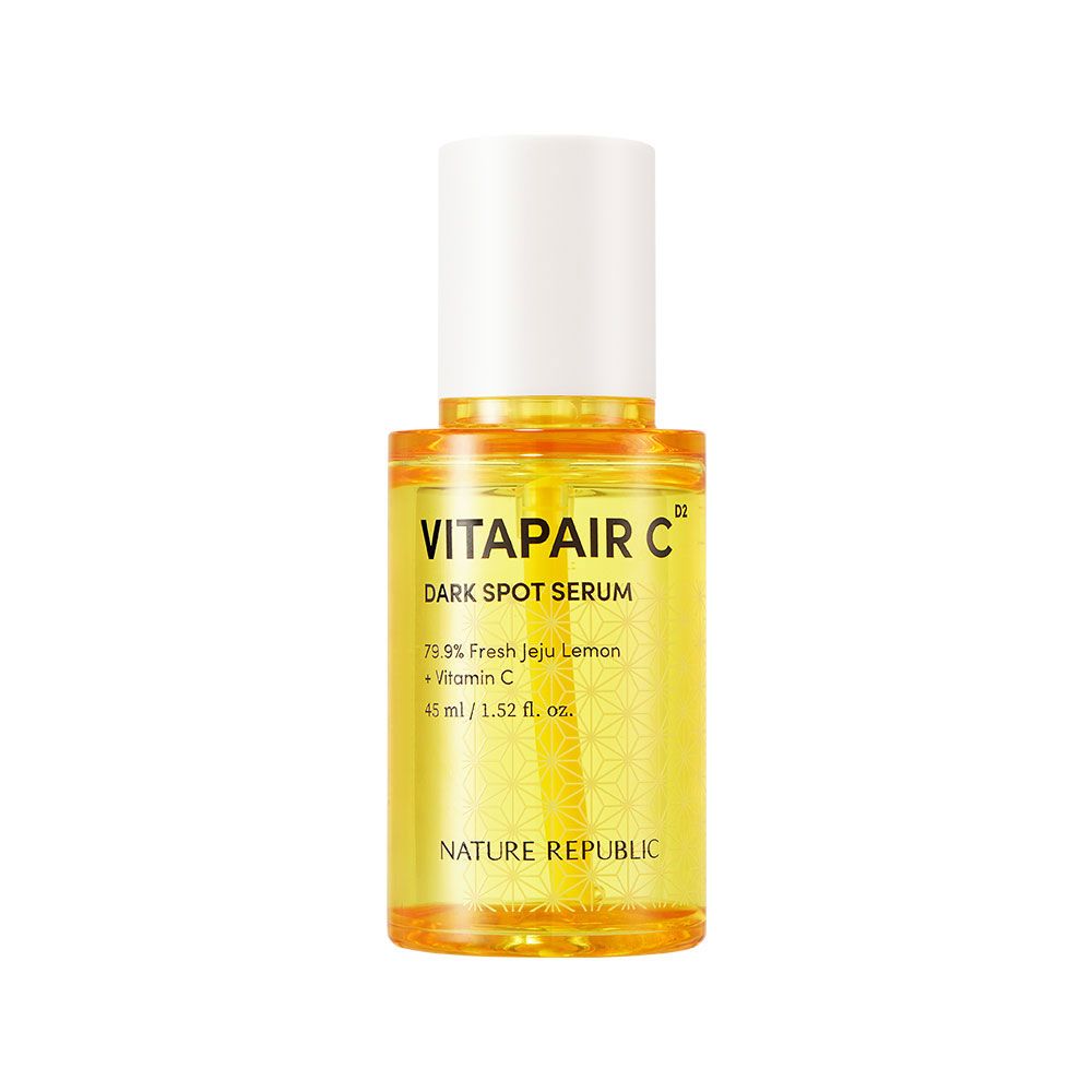Gelbliche Serumflasche mit weißem Deckel. Beschriftung: VITAPAIR C, Dark Spot Serum, NATURE REPUBLIC.