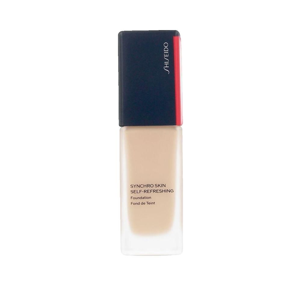 Foundation-Flakon. Rechteckige Form, transparente Basis, schwarzer Deckel mit rotem Akzent. SHISEIDO-Logo.