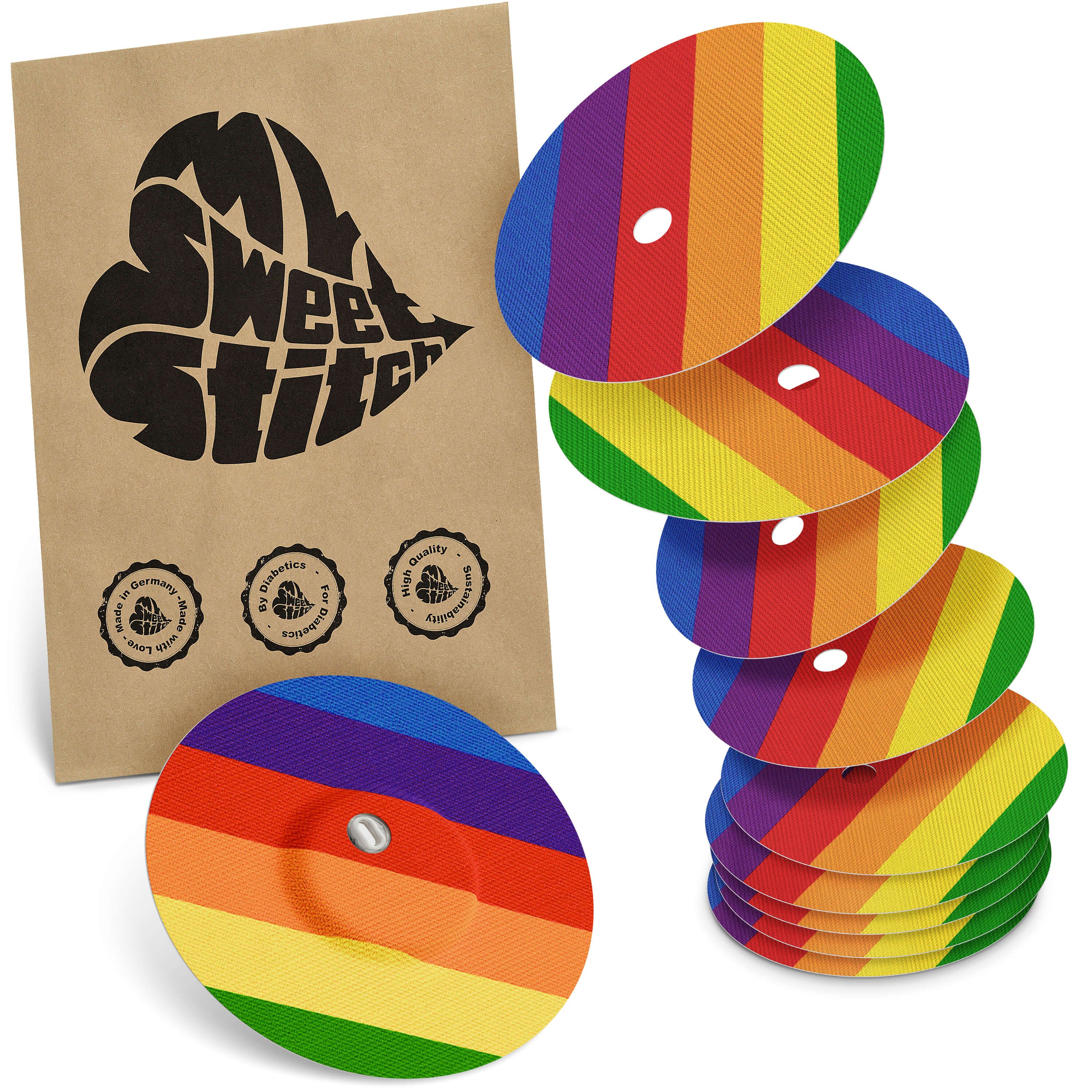 Packung mit Pflastern. Braune Verpackung mit Logo. Mehrere runde Pflaster mit Regenbogenmuster.