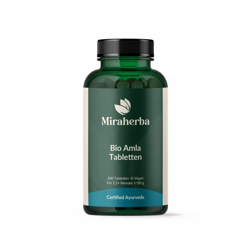 Grüne Glasflasche mit schwarzen Deckel. Aufschrift: Miraherba Bio Amla Tabletten. Zertifiziertes Ayurveda-Produkt.