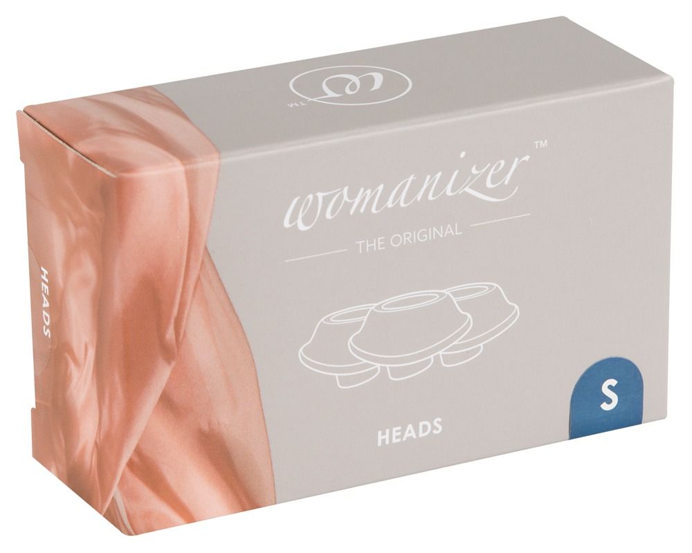 Verpackung mit Ersatzköpfen. Aufschrift: Womanizer, Heads, S. Illustration von drei Köpfen.