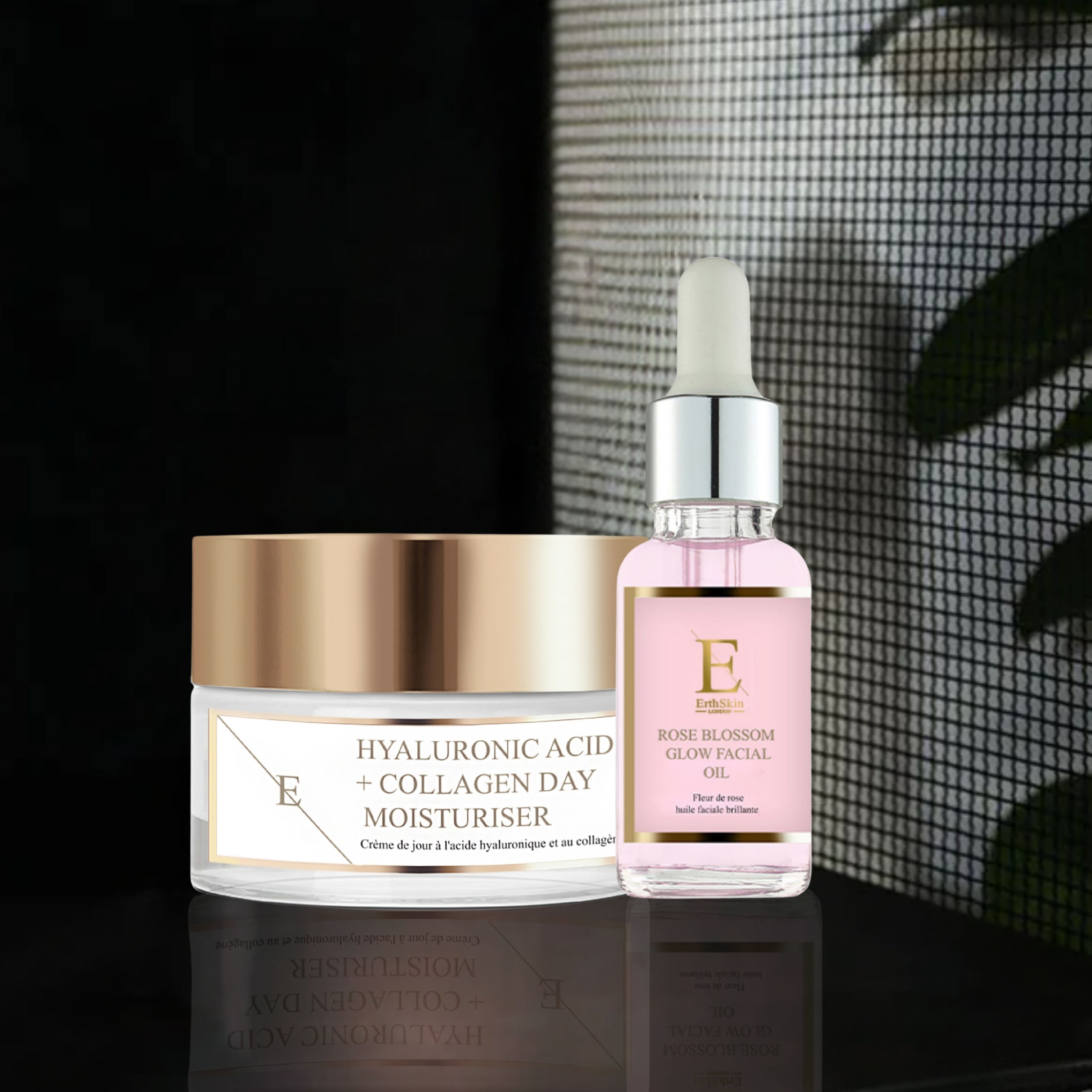 Gesichtsöl und Tagescreme. Creme mit goldfarbenem Deckel, Etikett mit Text. Ölflasche mit Pipette, rosa Flüssigkeit, Etikett mit Text.