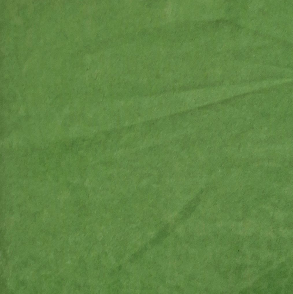 Grüner Stoff, gefaltet. Textur sichtbar.