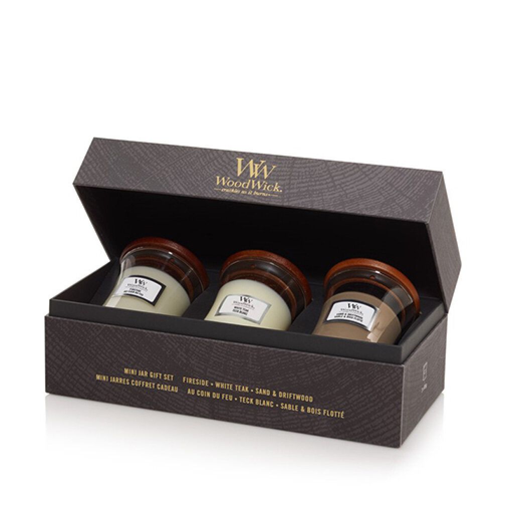 Geschenkset mit drei Mini-Kerzen in einer Schachtel. Die Kerzen haben Holzdeckel und sind in einer Geschenkbox verpackt. Der Markenname ist sichtbar.