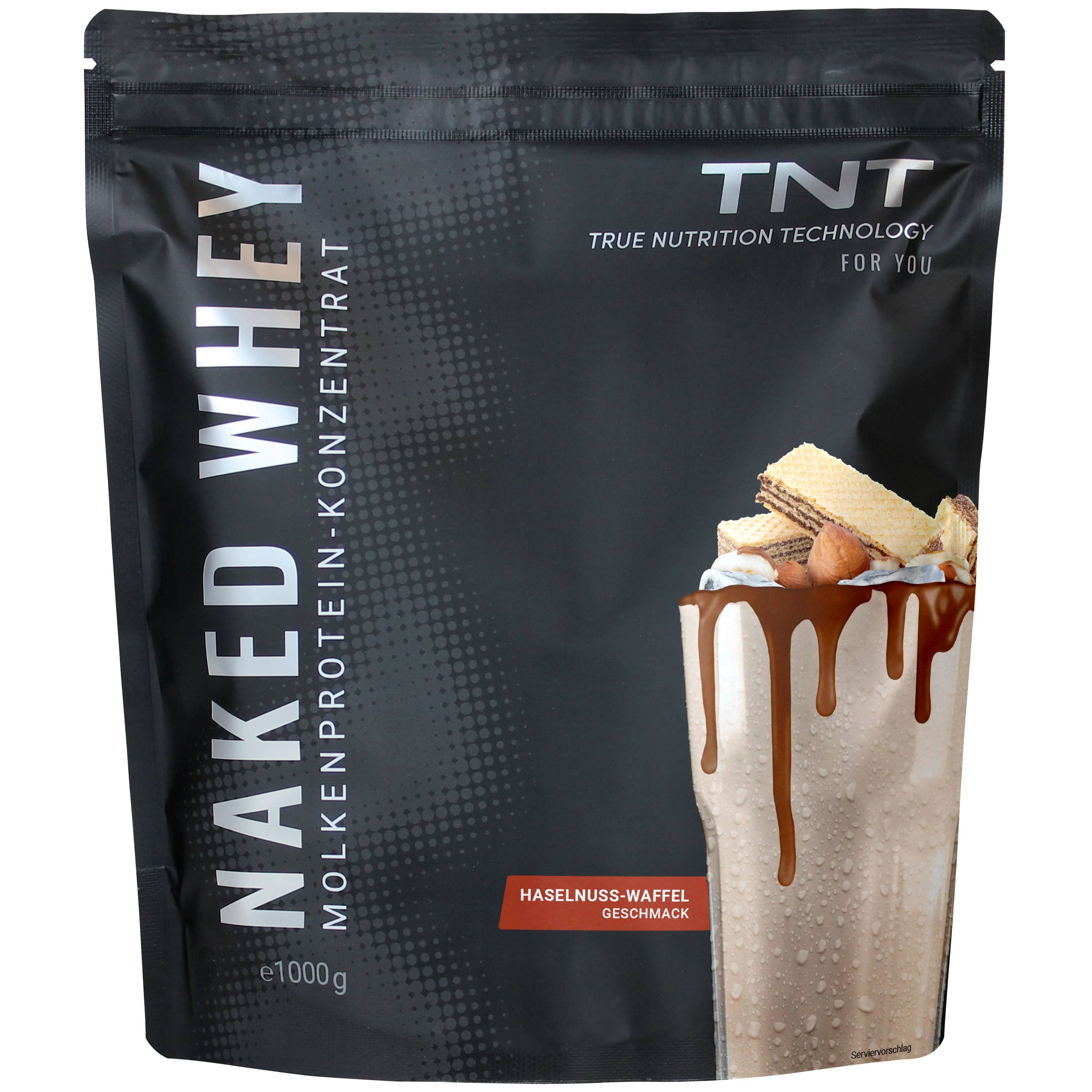 Schwarze Verpackung mit TNT Naked Whey. Aufschrift: Molkenproteinkonzentrat, Haselnuss-Waffel Geschmack. Abbildung eines Shakes.