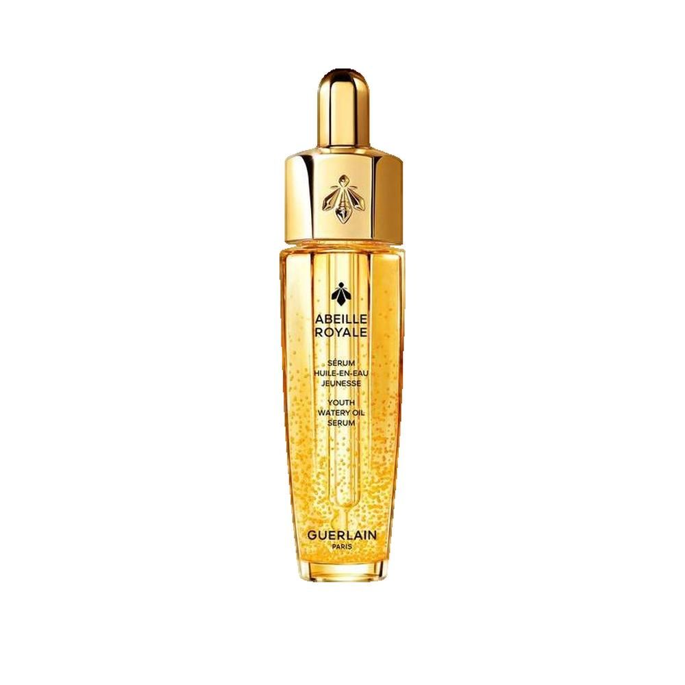 Goldfarbene Flasche mit goldenem Deckel. Aufschrift: Abeille Royale, Sérum Huile en Eau Jeunesse, Guerlain Paris.