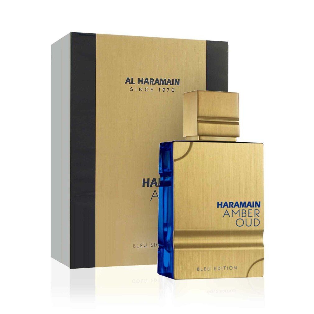 Goldfarbene Parfümflasche mit goldfarbenem Deckel und blauer Basis. Rechteckige Verpackung mit Markenlogo und Produktnamen.