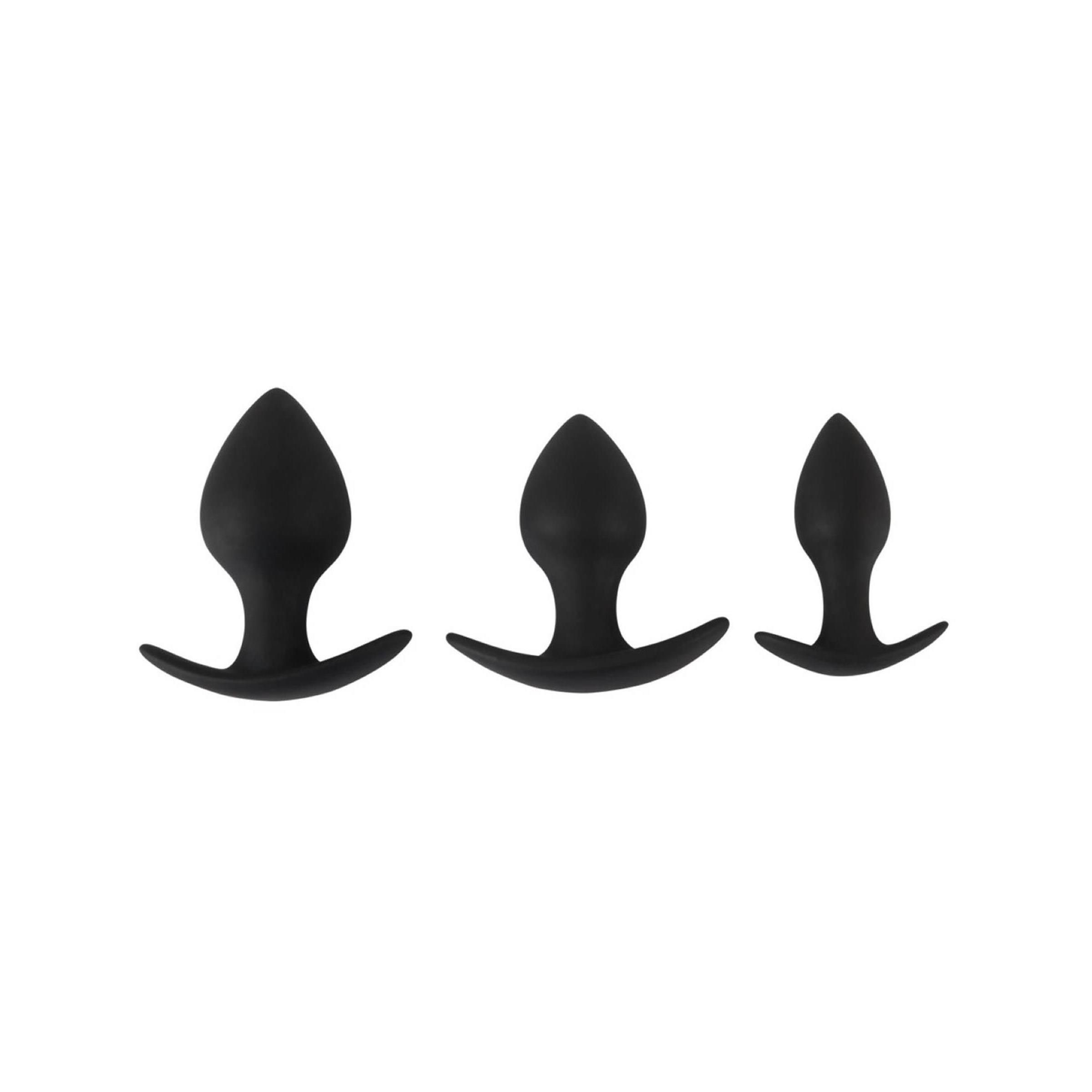 Drei schwarze Anal-Trainer mit konischer Spitze und gebogener Basis. Unterschiedliche Größen.